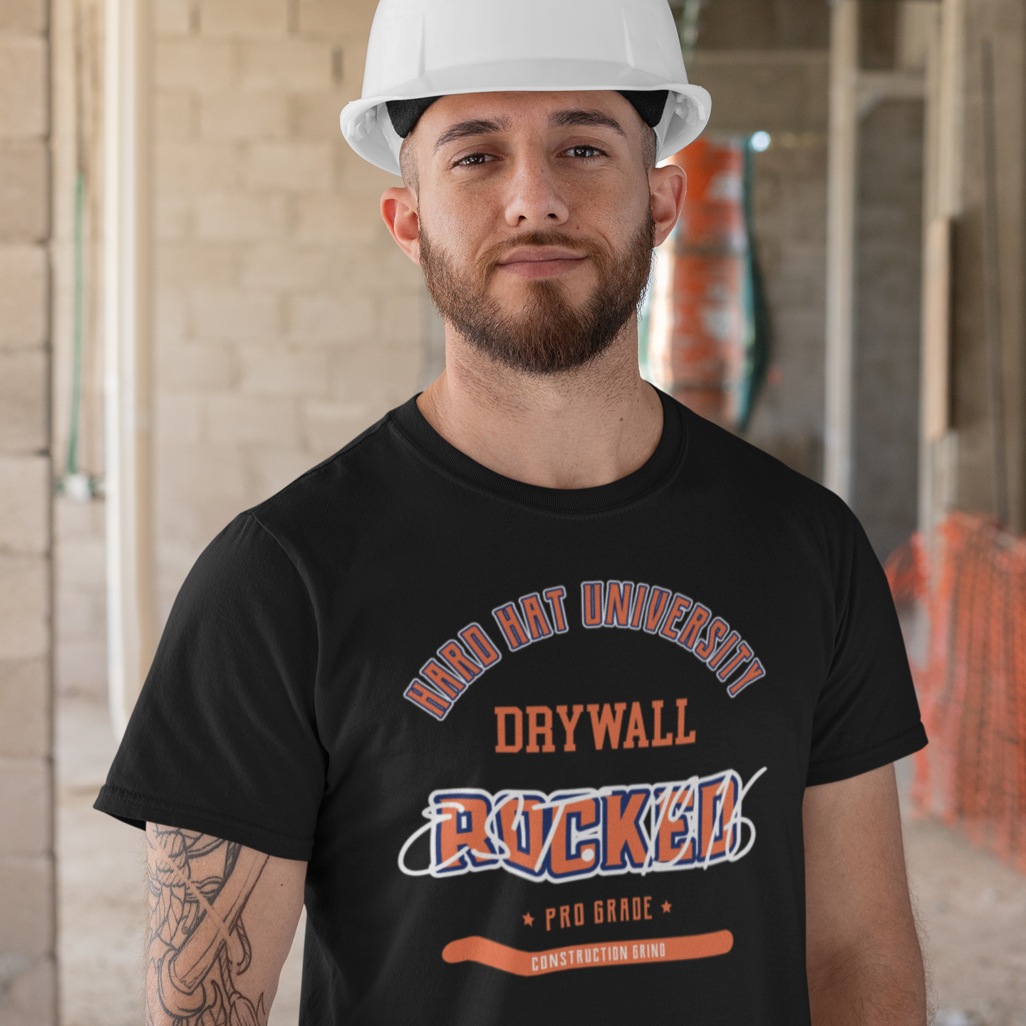 The Construction Grind “Hard Hat University” Drywaller's Trade T-Shirt features 'Drywall – Rocked' in bold college sports style lettering, paying tribute to the skill & professionalism that builds our world. The “Established” date represents the year the trade was formally recognized in the U.S. The 'PRO-GRADE' stamp adds a touch of authenticity and pride. Design is featured on a black Gildan 5000 short-sleeved T-Shirt made with 100% U.S. cotton. Heavy Cotton 5.3 oz/y.
