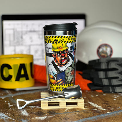 Construction Grind's "Meet the Crew" First Shift 12 oz. coffee tumbler sitting on a 4" wooden pallet coaster. Showing a close-up of our Site Superintendent, "Bobby", one of three crew members shown on the tumbler.