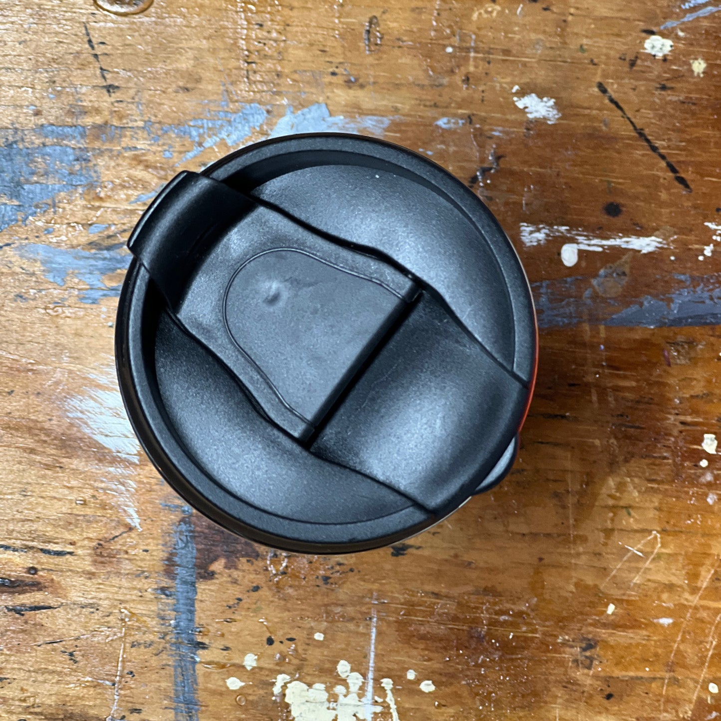 Showing the coffee tumbler's flip-top lid in the closed position.