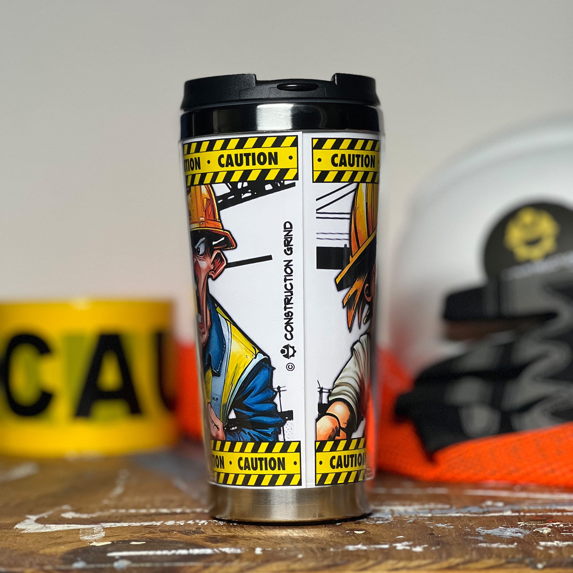 Construction Grind's "Meet the Crew" Second Shift 12 oz. coffee tumbler. Showing the rear image seam and our logo.