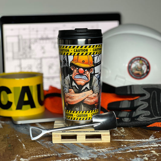 Construction Grind's "Meet the Crew" Third Shift 12 oz. coffee tumbler sitting on a 4" wooden pallet coaster with a stainless-steel shovel spoon. Showing our Site Superintendent, "Charlie", one of three crew members shown on the tumbler.