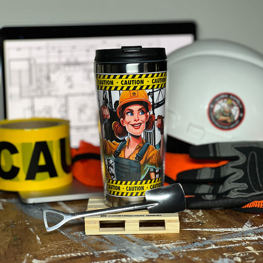 Construction Grind's "Women in Construction" 12 oz. coffee tumbler sitting on a 4" wooden pallet coaster with a stainless-steel shovel spoon. Showing our Site Superintendent, "Harper", one of three women construction professionals shown on the tumbler.