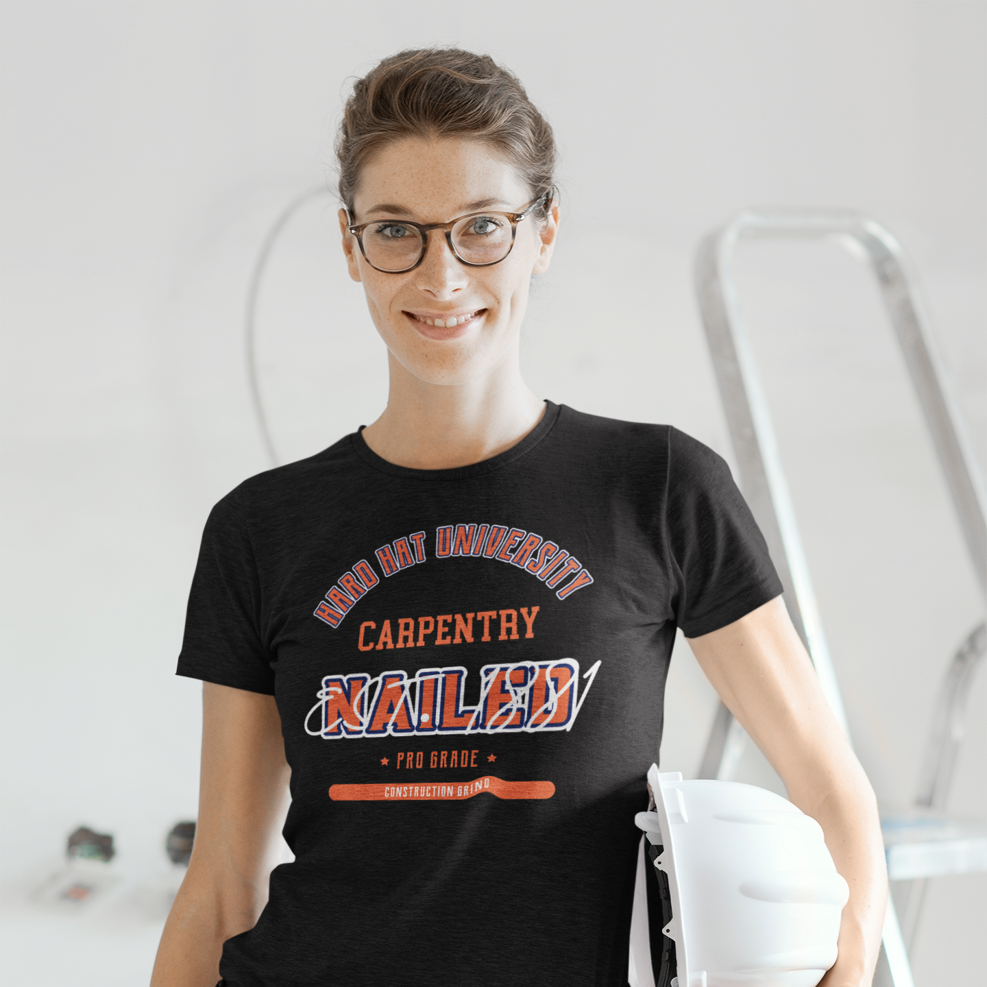 The Construction Grind “Hard Hat University” Carpenter's Trade T-Shirt features 'Carpentry – Nailed' in bold college sports style lettering, paying tribute to the skill & professionalism that builds our world. The “Established” date represents the year the trade was formally recognized in the U.S. The 'PRO-GRADE' stamp adds a touch of authenticity and pride. Design is featured on a black Gildan 5000 short-sleeved T-Shirt made with 100% U.S. cotton. Heavy Cotton 5.3 oz/y.