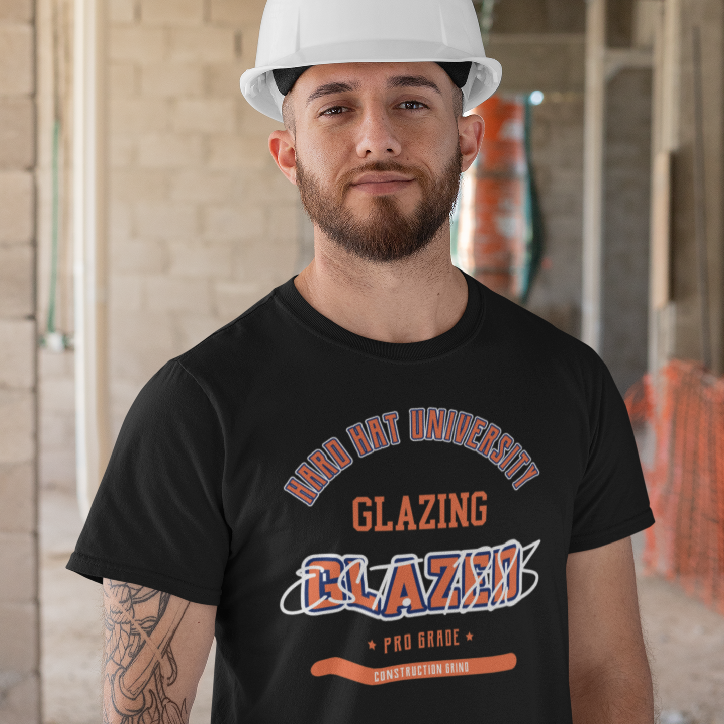 The Construction Grind “Hard Hat University” Glazier's Trade T-Shirt features 'Glazing – Glazed' in bold college sports style lettering, paying tribute to the skill & professionalism that builds our world. The “Established” date represents the year the trade was formally recognized in the U.S. The 'PRO-GRADE' stamp adds a touch of authenticity and pride. Design is featured on a black Gildan 5000 short-sleeved T-Shirt made with 100% U.S. cotton. Heavy Cotton 5.3 oz/y.