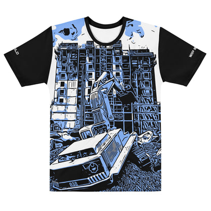 Our Construction Grind Dig Alert all-over print short-sleeved t-shirt in our blue jeans style, shown from the front. The main graphic features a large excavator actively digging rough terrain at a construction site in front of a building under construction, highlighting dynamic construction imagery. The design is printed in vibrant colors on a premium, all-over print tee.