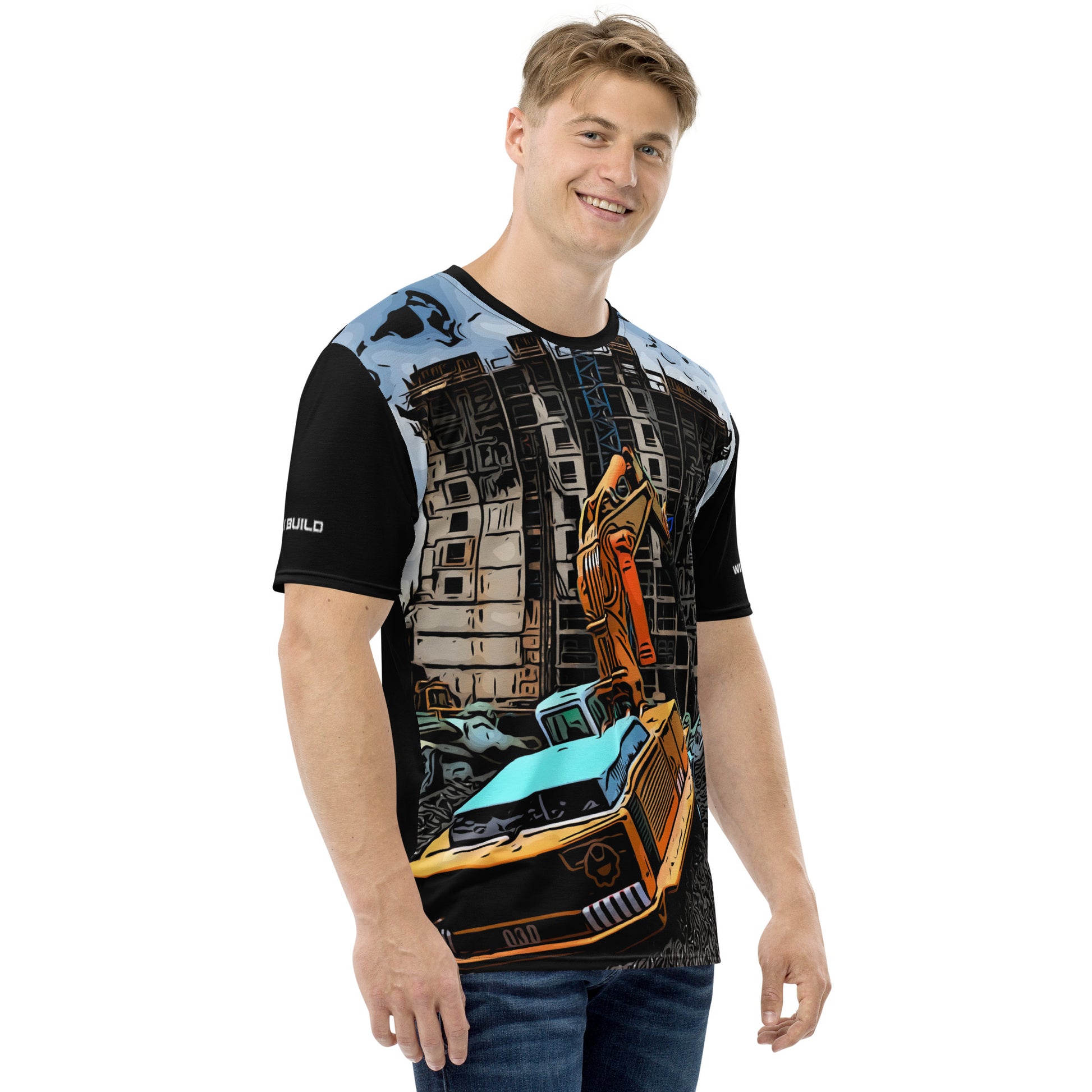 A man wearing our Construction Grind Dig Alert all-over print short-sleeved t-shirt in cartooned style, shown from the right-hand view. The image reveals the detailed main graphic of a dump truck in action on a construction site, and the right sleeve displays a white 'I Build' graphic. The design emphasizes bold construction imagery on a premium tee.