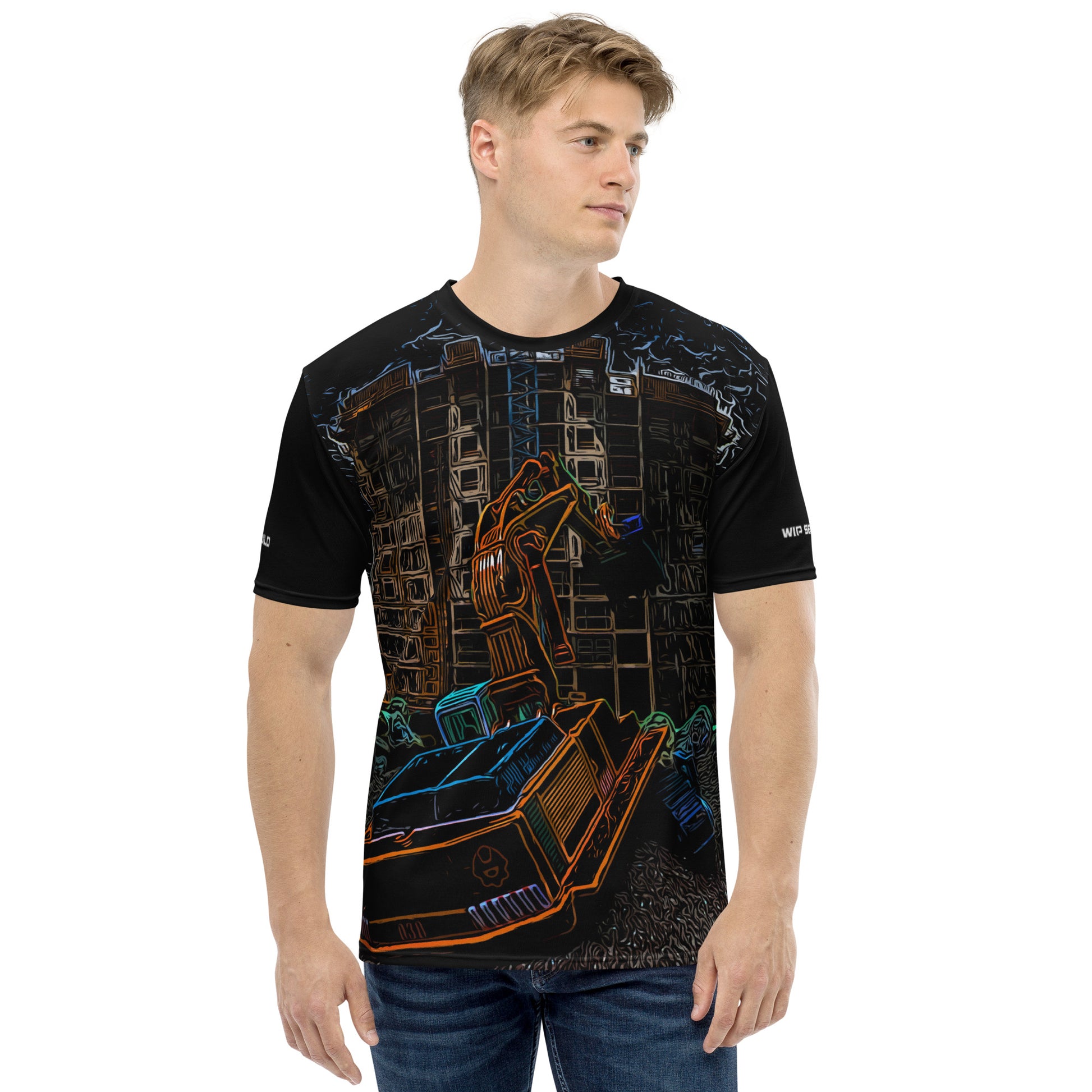 A man wearing our Construction Grind Dig Alert all-over print short-sleeved t-shirt in our night shift style, shown from the front. The main graphic features a large excavator actively digging rough terrain at a construction site in front of a building under construction, highlighting dynamic construction imagery. The design is printed in vibrant colors on a premium, all-over print tee.