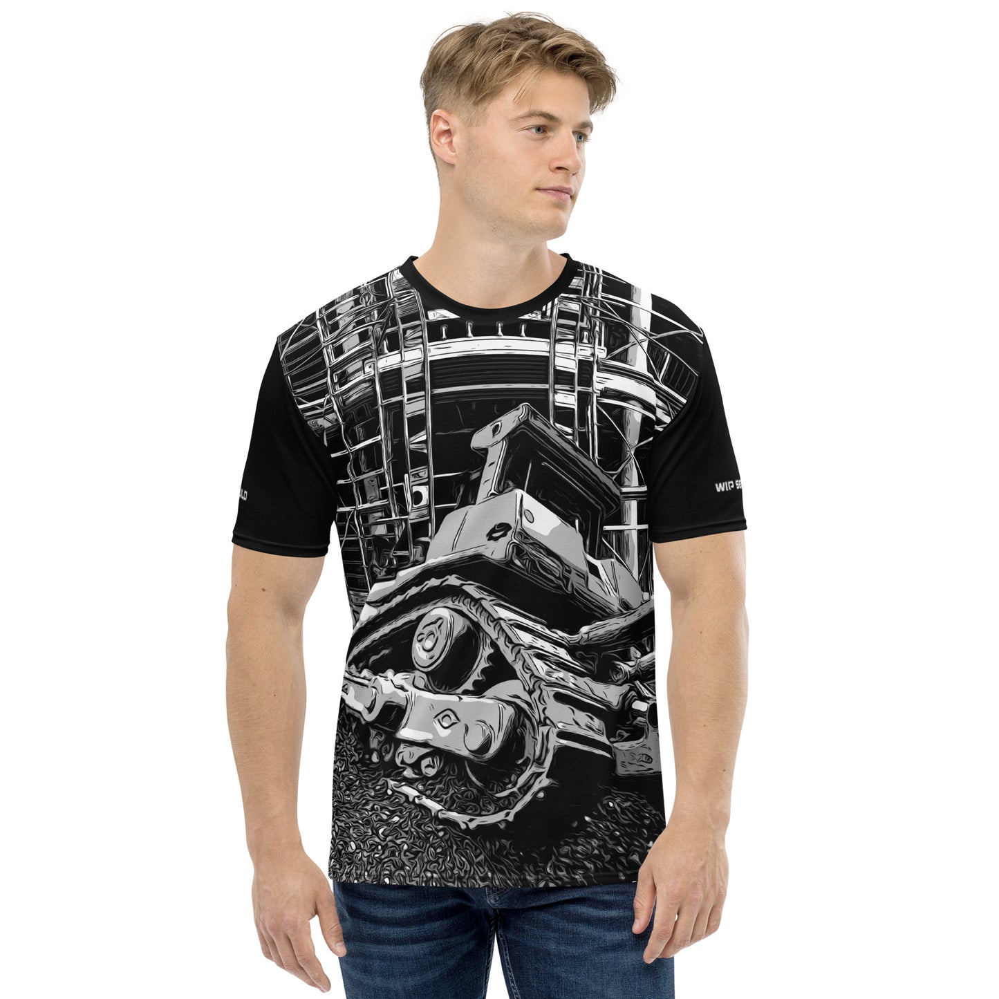 A man wearing our Construction Grind Dozer Duty all-over print short-sleeved t-shirt in our black and white style, shown from the front. The main graphic features a large bulldozer actively pushing dirt at a construction site in front of a building under construction, highlighting dynamic construction imagery. The design is printed in vibrant colors on a premium, all-over print tee.