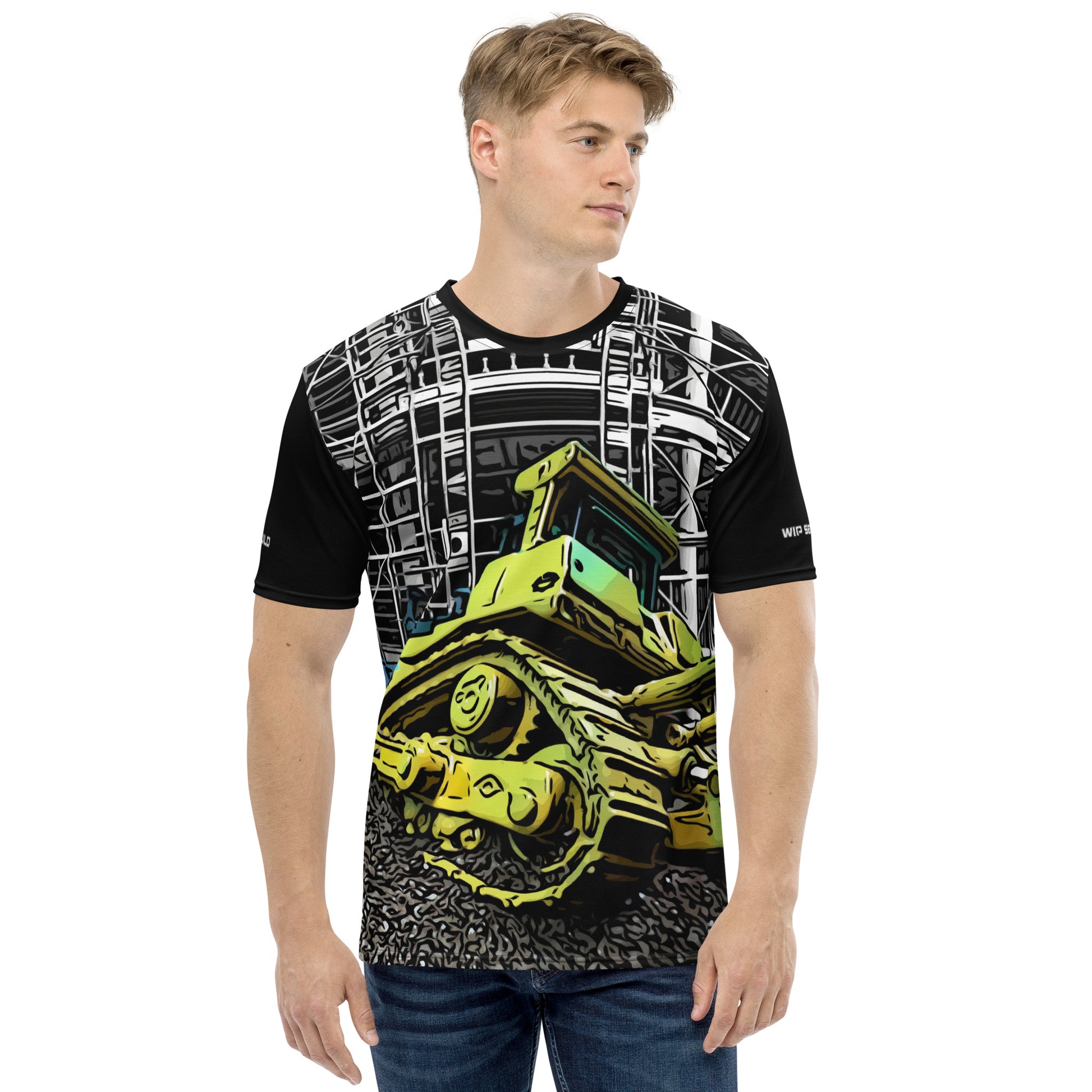 A man wearing our Construction Grind Dozer Duty all-over print short-sleeved t-shirt in our cartooned style, shown from the front. The main graphic features a large bulldozer actively pushing dirt at a construction site in front of a building under construction, highlighting dynamic construction imagery. The design is printed in vibrant colors on a premium, all-over print tee.