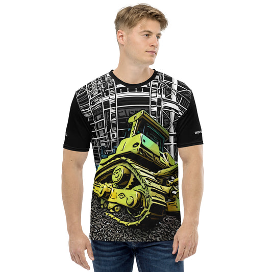 A man wearing our Construction Grind Dozer Duty all-over print short-sleeved t-shirt in our cartooned style, shown from the front. The main graphic features a large bulldozer actively pushing dirt at a construction site in front of a building under construction, highlighting dynamic construction imagery. The design is printed in vibrant colors on a premium, all-over print tee.