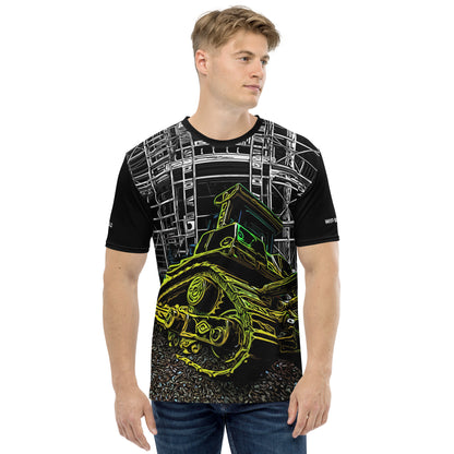 A man wearing our Construction Grind Dozer Duty all-over print short-sleeved t-shirt in our night shift style, shown from the front. The main graphic features a large bulldozer actively pushing dirt at a construction site in front of a building under construction, highlighting dynamic construction imagery. The design is printed in vibrant colors on a premium, all-over print tee.