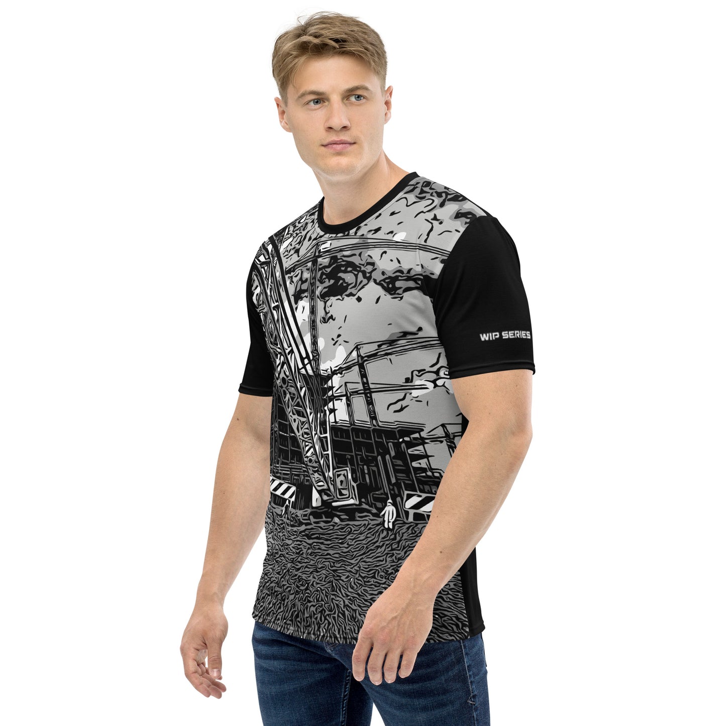 A man our wearing Construction Grind Heavy Lift all-over print short-sleeved t-shirt in black and white style, shown from the left-hand view. The image reveals the detailed main graphic of a large crane in action on a construction site, and the left sleeve displays a white 'WIP SERIES' graphic. The design emphasizes bold construction imagery on a premium tee.