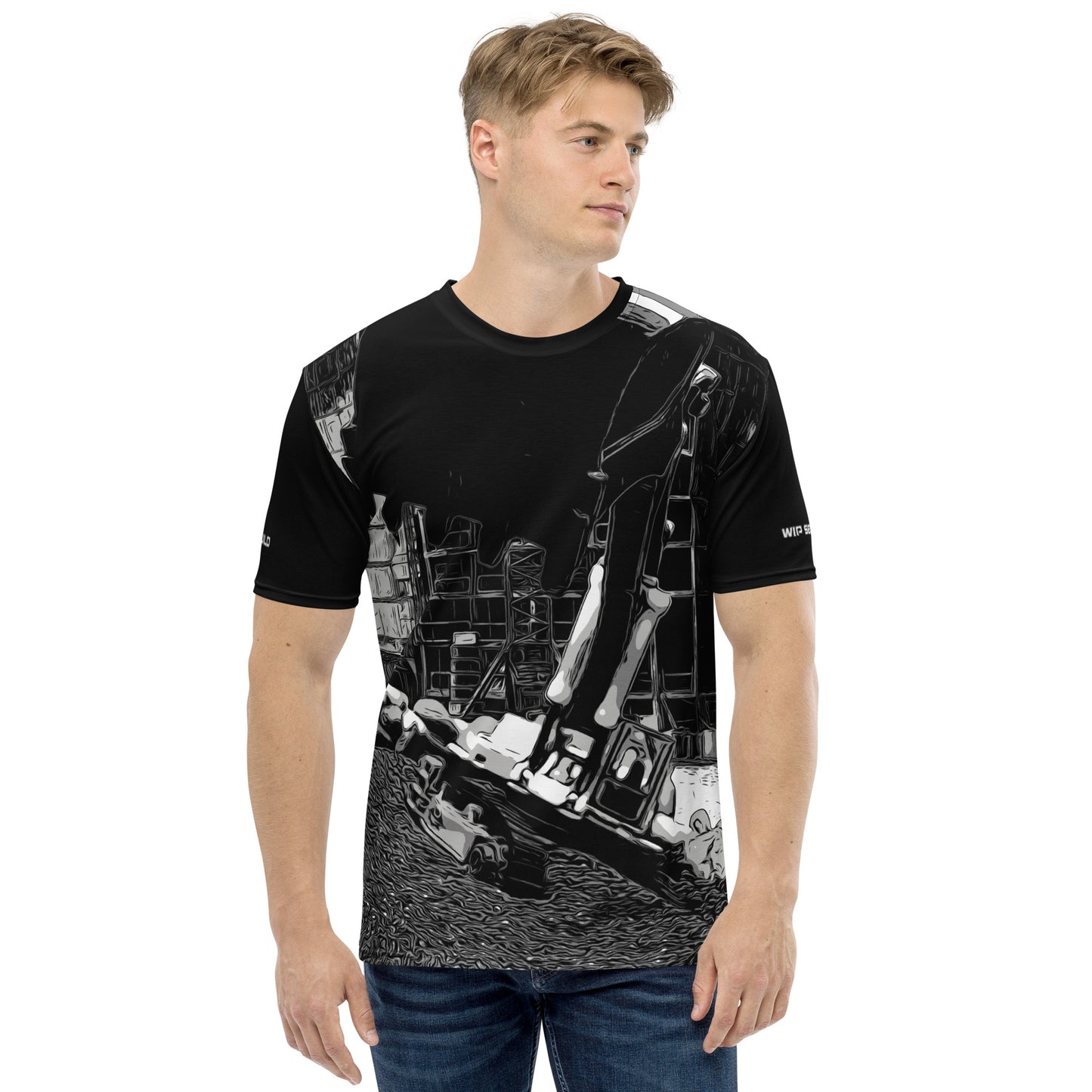 A man wearing our Construction Grind Super Scooper all-over print short-sleeved t-shirt in our black and white style, shown from the front. The main graphic features a large excavator with the shovel front and center, digging at a construction site in front of a building under construction, highlighting dynamic construction imagery. The design is printed in vibrant colors on a premium, all-over print tee.