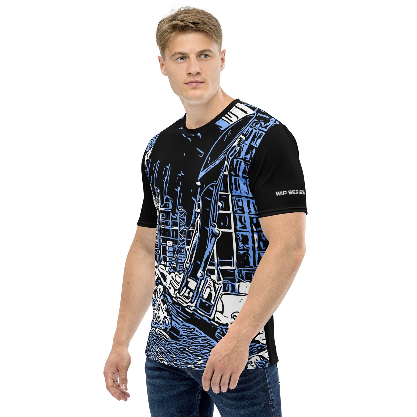 A man our wearing Construction Grind Super Scooper all-over print short-sleeved t-shirt in blue jeans style, shown from the left-hand view. The image reveals the detailed main graphic of an excavator in action on a construction site, and the left sleeve displays a white 'WIP SERIES' graphic. The design emphasizes bold construction imagery on a premium tee.