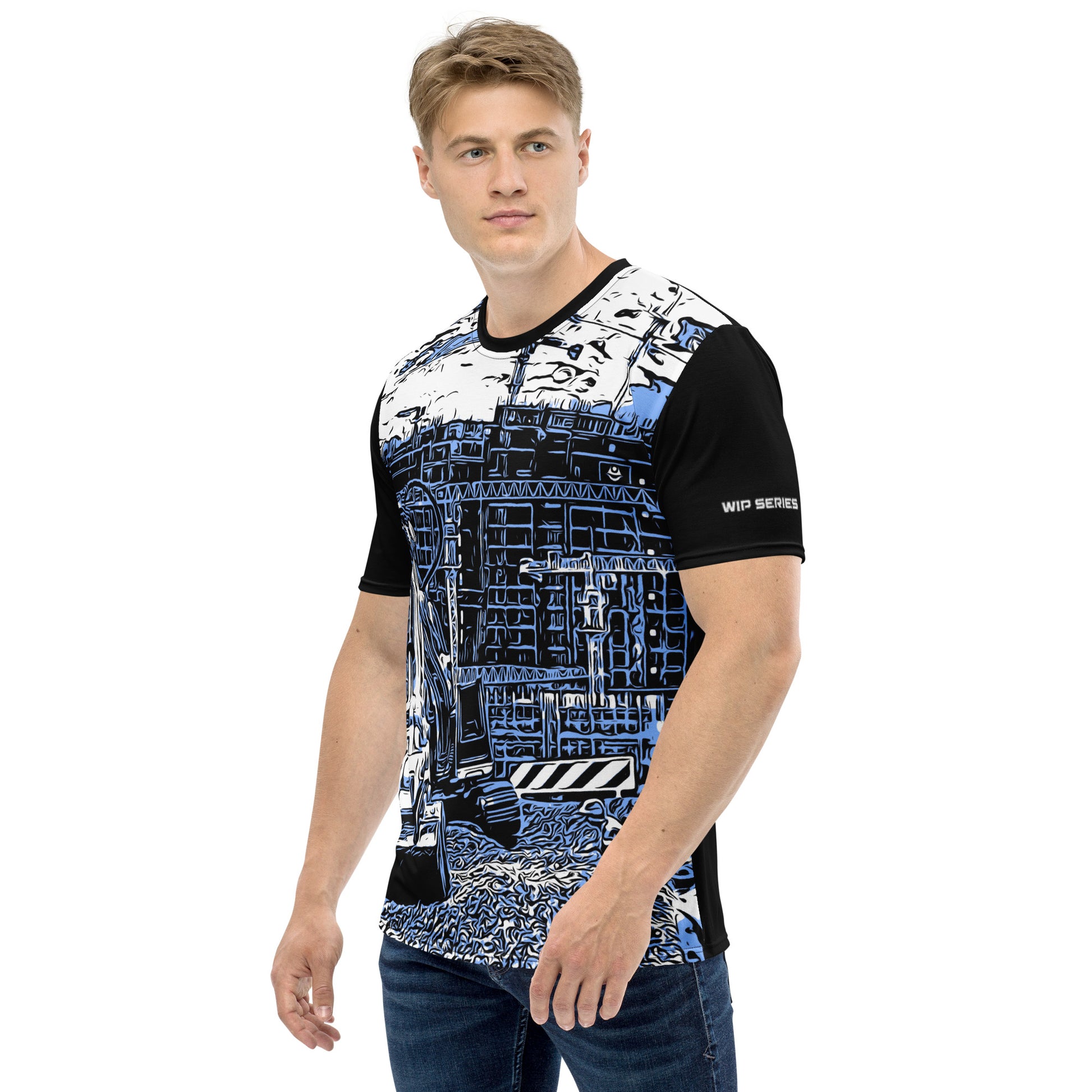 A man our wearing Construction Grind Trenching all-over print short-sleeved t-shirt in blue jeans style, shown from the left-hand view. The image reveals the detailed main graphic of a backhoe in action on a construction site, and the left sleeve displays a white 'WIP SERIES' graphic. The design emphasizes bold construction imagery on a premium tee.