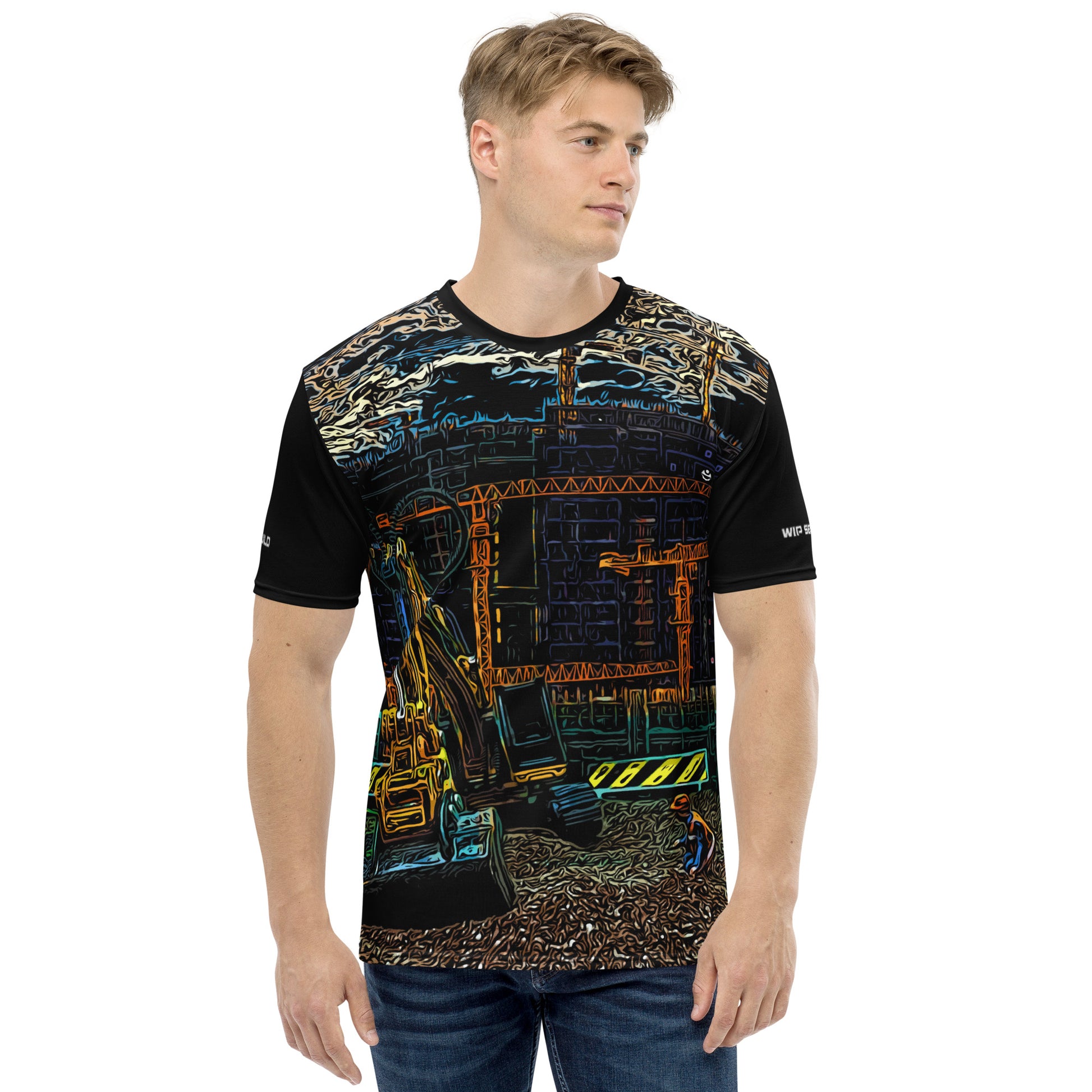 A man wearing our Construction Grind Trenching all-over print short-sleeved t-shirt in our cartooned style, shown from the front. The main graphic features a backhoe digging a trench in front of large tower cranes at a construction site in front of a building under construction, highlighting dynamic construction imagery. The design is printed in vibrant colors on a premium, all-over print tee.